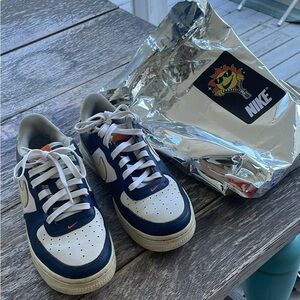 Nike Kids' Navy and White Sneakers with Orange Accents